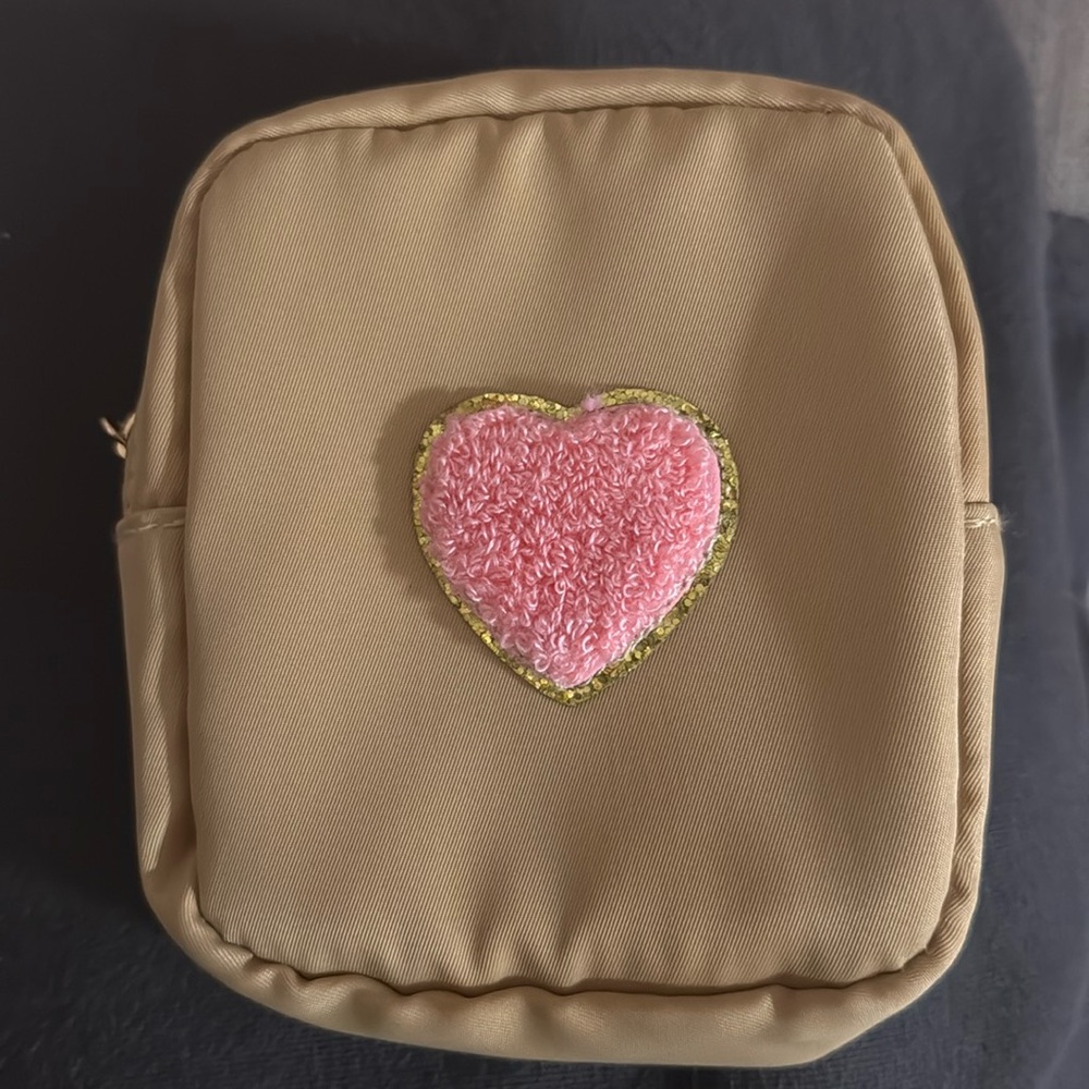 Small beige travel pouch